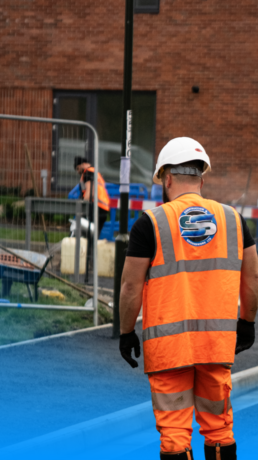 SS Construction commercial team member walking through a live housing development site